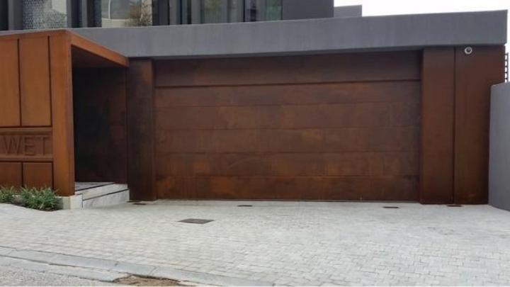 BH4 Doors Sectional overhead door manufactured from corten steel BH4 Doors Sectional overhead door manufactured from corten steel