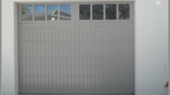 BH4 Doors - Vertically-boarded sectional overhead door with glass panels BH4 Doors - Vertically-boarded sectional overhead door with glass panels