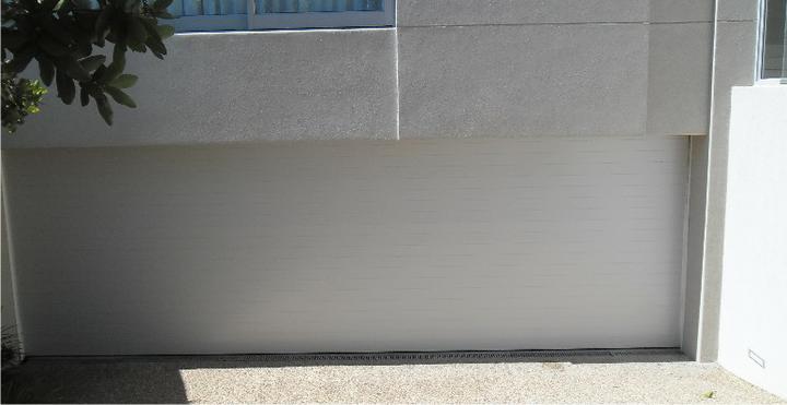 BH4 Doors 6.9m wide smooth finish aluminium sectional overhead door BH4 Doors 6.9m wide smooth finish aluminium sectional overhead door