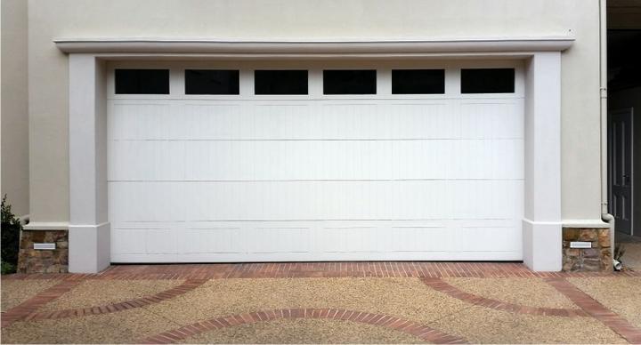 BH4 Doors Vertically-boarded sectional overhead door with glass panels BH4 Doors Vertically-boarded sectional overhead door with glass panels