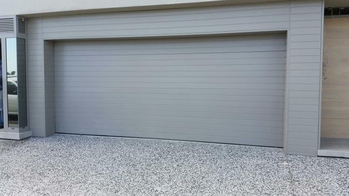 BH4 Doors - Aluminium sectional overhead door with matching wall cladding BH4 Doors - Aluminium sectional overhead door with matching wall cladding